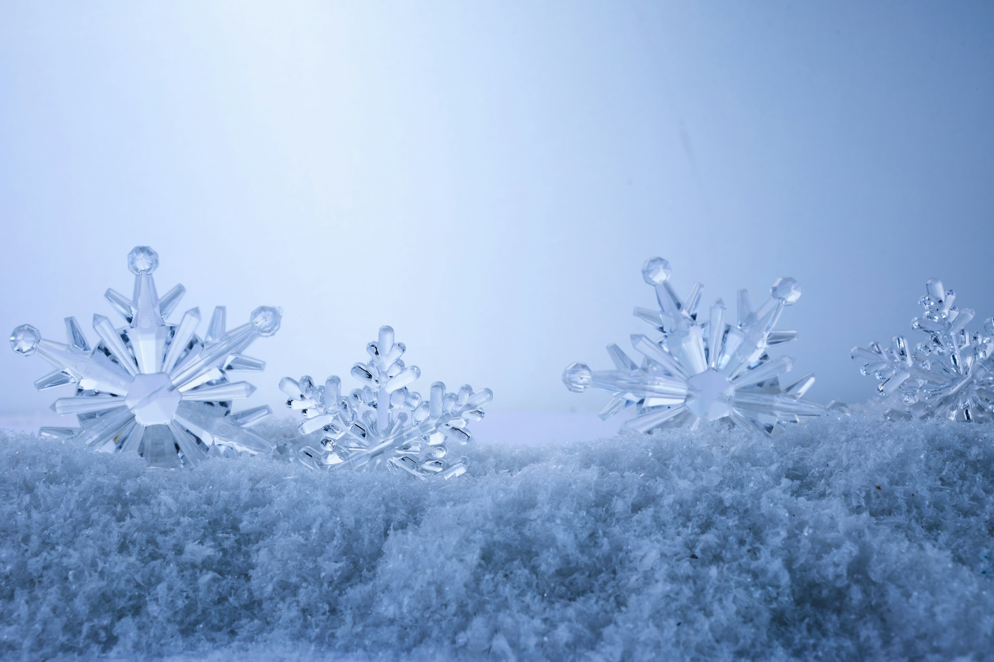 Blue Christmas snowflakes background. Winter background with snowflakes.