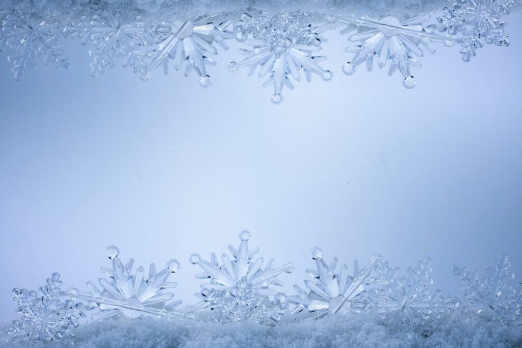 Blue Christmas snowflakes background. Winter background with snowflakes.