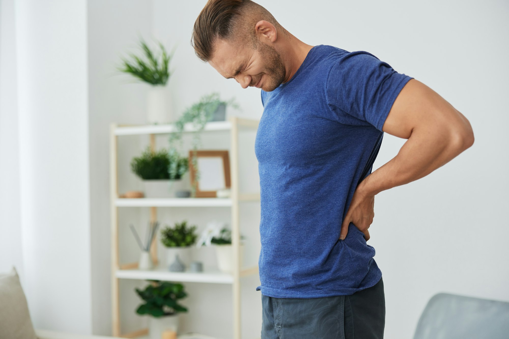 Man backache neck and shoulder pain, inflammation of muscles and ligaments rupture during sports