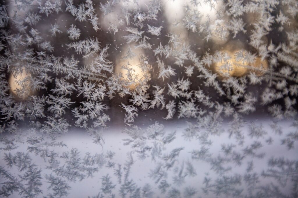 Snowflake patterns on glass